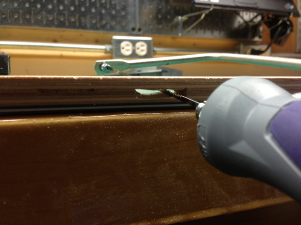 Clearing out the SD card slot with a coping saw.