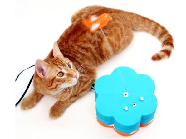 Mark de Vinck’s Kitty Twitty Cat Toy sends Twitter updates to the internet when the cat engages the toy bird. Cats can send Tweets by ‘paw slapping’ the toy bird, which sits atop a guitar string that’s connected to an Arduino. The Arduino sends the cat’s status using an Ethernet cable connected to the internet. Depending on the cat’s mood, users could find their inbox spammed with Twitter updates.