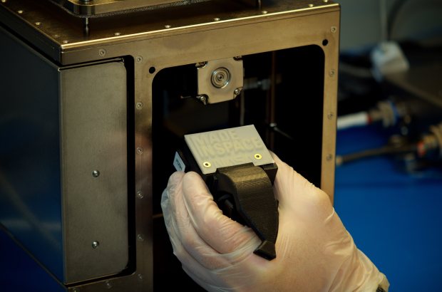 The ‘First Print’ in space is a part of the printer itself. The printhead faceplate holds internal wiring in place within the 3D printer’s extruder.
