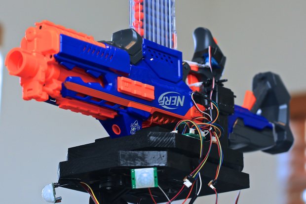 Jason_Mechatronic’s Robotic Nerf Gun uses two motion sensors and servo motors to track targets while another pair of servo motors operates the trigger.